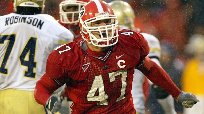 Georgia defensive end David Pollack (47) reacts after Georgia Tech quarterback Reggie Ball is sacked for 13-yard loss in their match up Saturday, Nov. 27, 2004.
