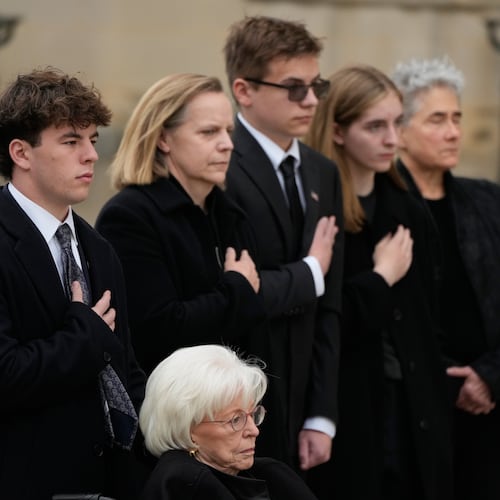 Wife of former Vice President Dick Cheney, Lynne Cheney in wheelchair, along with family preside over the arrival of the casket of former Vice President Dick Cheney at the Washington National Cathedral, Thursday, Nov. 20, 2025, in Washington. (AP Photo/Mark Schiefelbein)