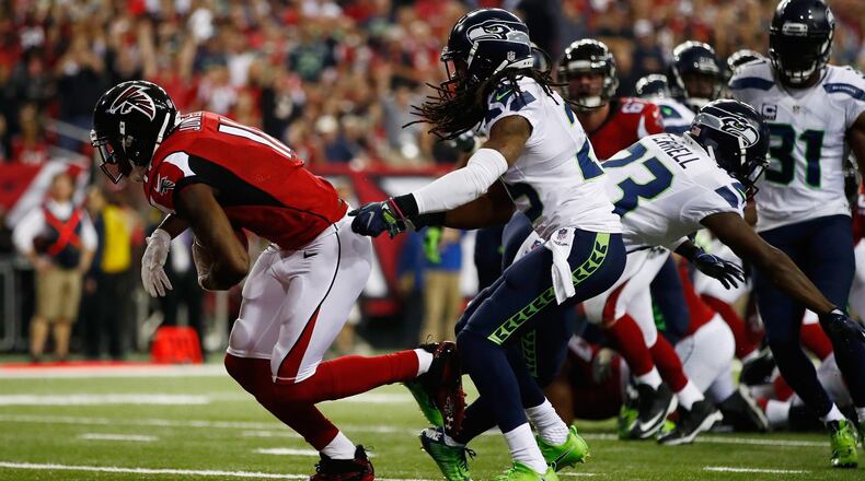 Julio Jones #11 of the Atlanta Falcons scores a touchdown against the Seattle Seahawks at the Georgia Dome on January 14, 2017 in Atlanta, Georgia. (Photo by Gregory Shamus/Getty Images)