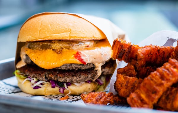 Grindhouse Killer Burgers sells an Impossible Burger, including this the Dixie style, at five locations. (Henri Hollis/AJC 2020)