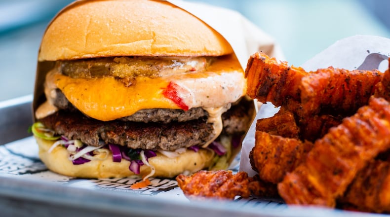 Grindhouse Killer Burgers sells the Impossible Burger at five locations. This shows the Dixie Style burger at Grindhouse on Memorial Drive. CONTRIBUTED BY HENRI HOLLIS