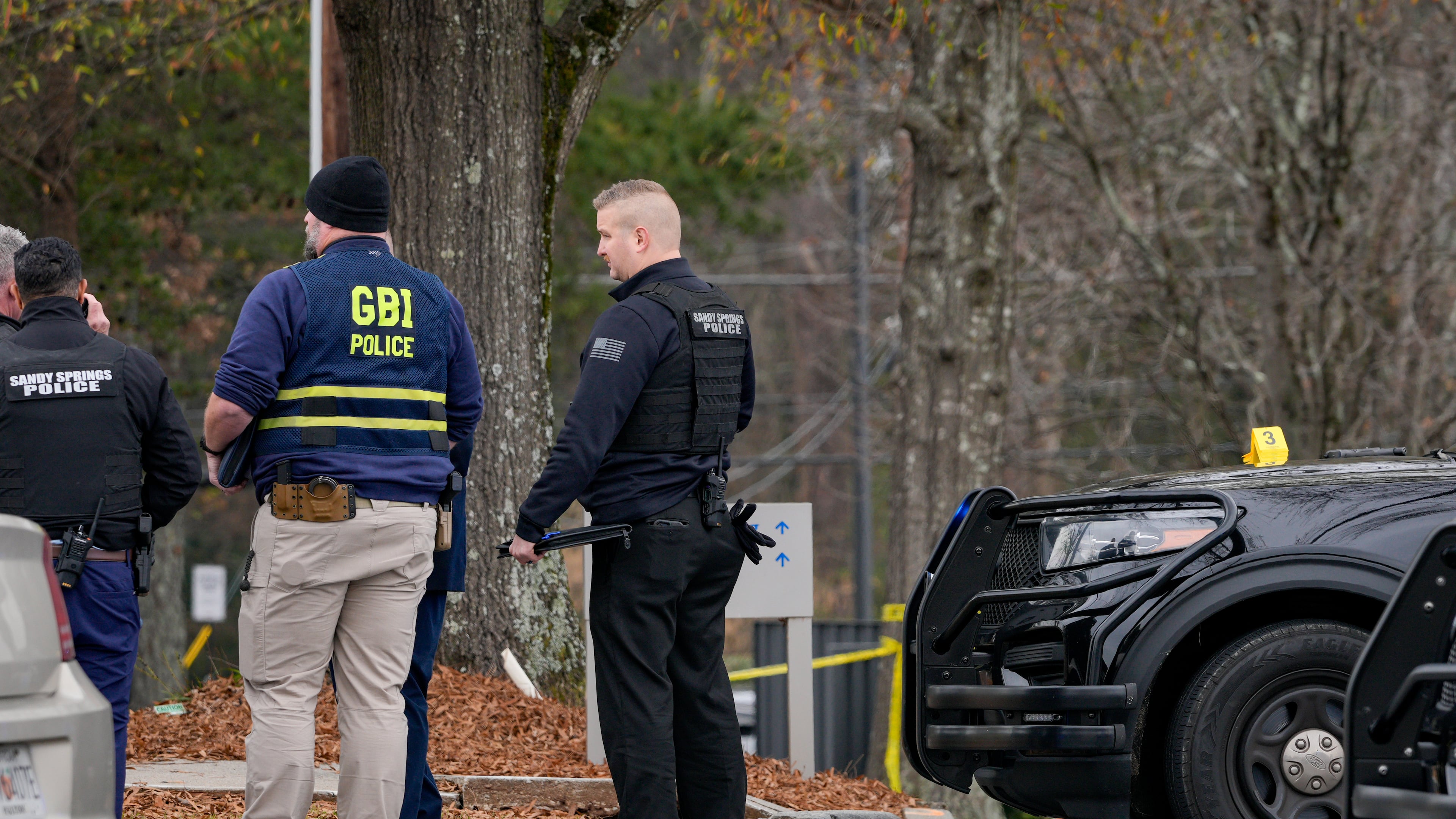 Sandy Springs officers responded to a police shooting in the area of Roswell Road and Dunwoody Place on Thursday. (Ben Hendren for the AJC)