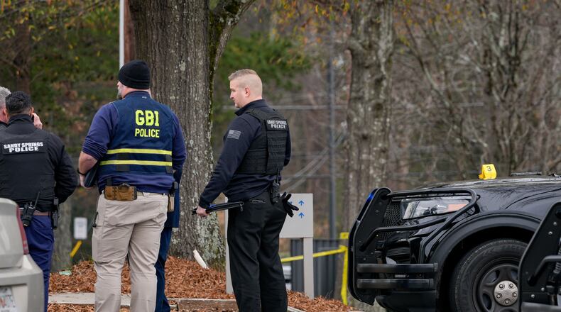 Sandy Springs officers responded to a police shooting in the area of Roswell Road and Dunwoody Place on Thursday. (Ben Hendren for the AJC)