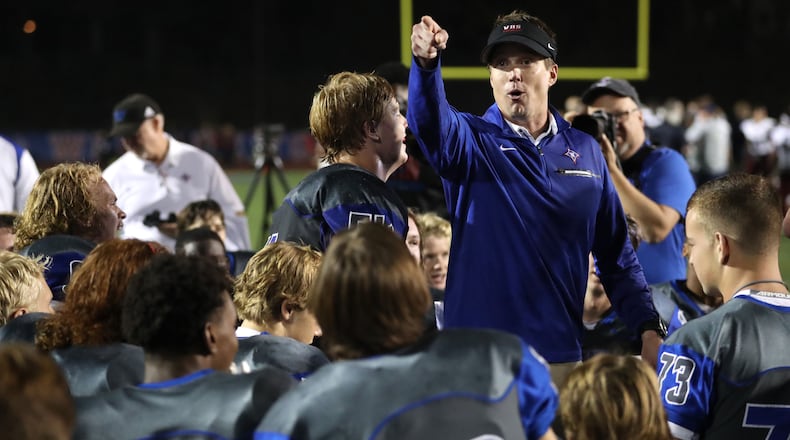 Walton head coach Daniel Brunner addresses his players following a win.