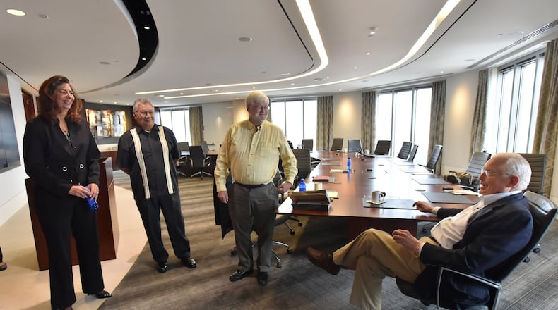 Atlanta lawyer Emmet Bondurant, right, chats Thursday with members of the California Citizens Redistricting Commission — from left, Jodie Filkins Webber, Gabino Aguirre and Stan Forbes — at Bondurant Mixson & Elmore LLP on Thursday. HYOSUB SHIN / HSHIN@AJC.COM