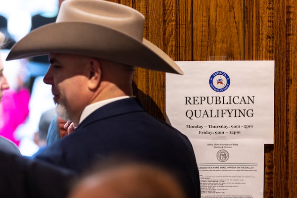 Republicans line up in 2024 to sign paperwork to run for election. (Arvin Temkar/AJC)