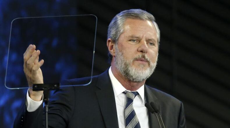 Liberty University President Jerry Falwell Jr. apologized Monday for a tweet that included a racist photo that appeared on Gov. Ralph Northam's medical school yearbook page decades ago.