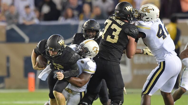 October 21, 2017 Atlanta - Wake Forest quarterback John Wolford (10) is taken down by Georgia Tech linebacker Victor Alexander (9) in the second half of an NCAA college football game at Bobby Dodd Stadium on Saturday, October 21, 2017. Georgia Tech beat Wake Forest 38-24. HYOSUB SHIN / HSHIN@AJC.COM