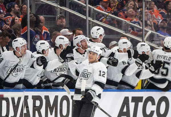 Los Angeles Kings' Trevor Moore (12) celebrates a goal against the Edmonton Oilers during the second period of an NHL hockey playoff game in Edmonton, Alberta, Friday, April 25, 2025. (Jason Franson/The Canadian Press via AP)