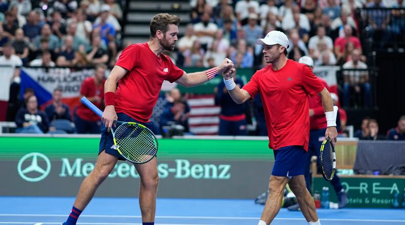 United States' Christian Harrison, right, and Austin Krajicek celebrate after winning a point against Czechia's Adam Pavlasek and Patrik Rikl during the Davis Cup second round qualifier match between the Czech Republic and the United States, in Prague, Saturday, Sept. 19, 2026. (AP Photo/Petr David Josek)