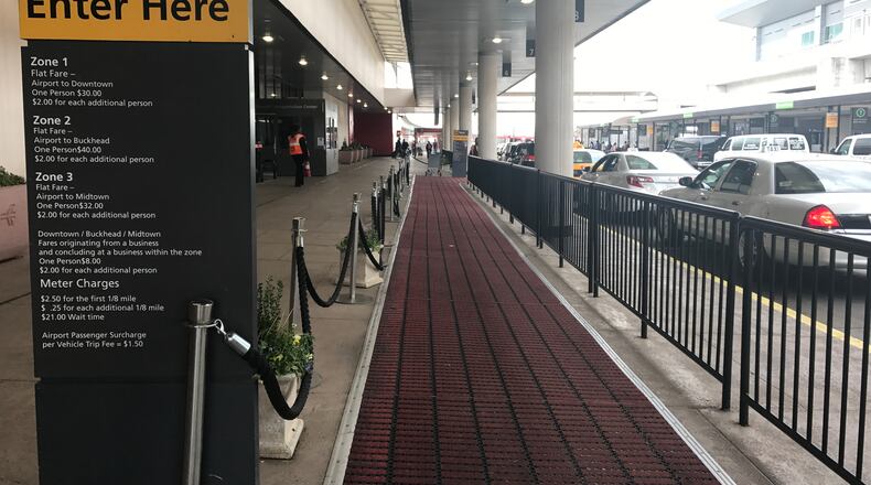 The "red carpet" for taxi customers at the taxi pick-up area outside the west exit of the domestic terminal at Hartsfield-Jackson