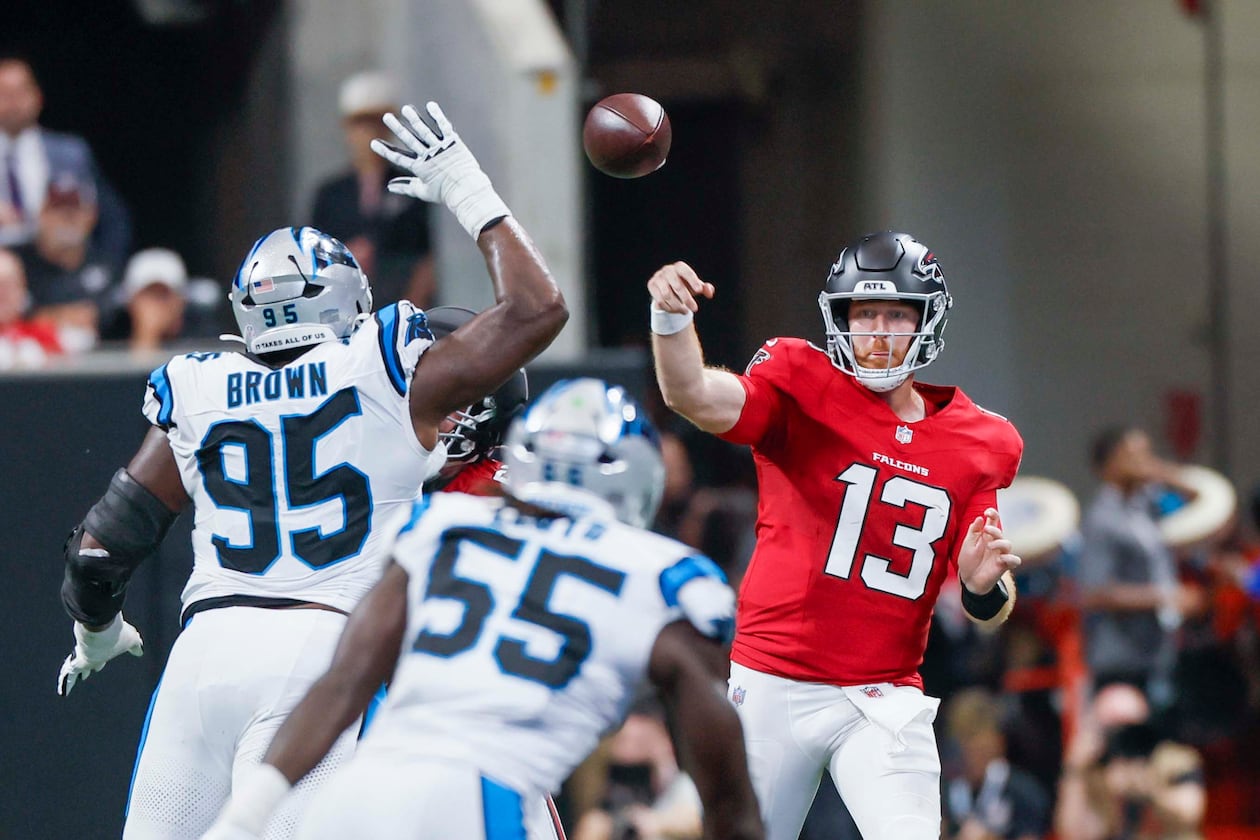 Atlanta Falcons quarterback Cooper Rush attempts a pass in the first half of an NFL game against the Carolina Panthers at Mercedes-Benz Stadium in Atlanta on Sunday, Sept. 20, 2026. (Miguel Martinez/AJC)