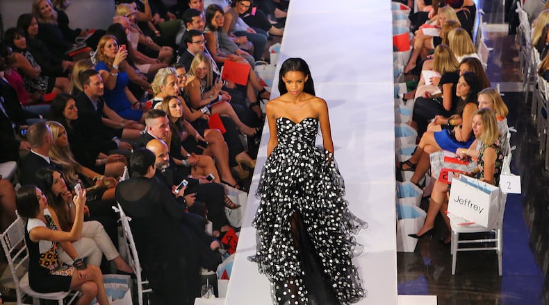 A model in a black and white dress garners some attention during the Jeffrey Cares Fashion Show Monday, Aug. 25, 2014, in Atlanta. The show raises awareness and funds for its beneficiaries the Susan G. Komen for the Cure Greater Atlanta Affiliate and the Atlanta AIDS Fund. CURTIS COMPTON / CCOMPTON@AJC.COM
