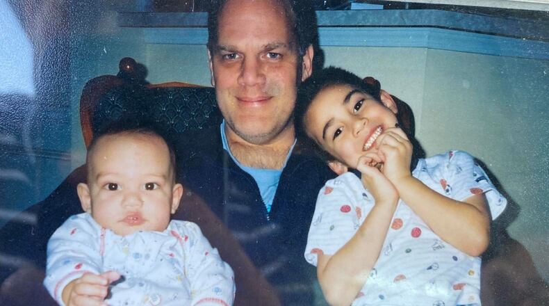 Christopher Newhouse (right) is mourning the deaths of his father, Howard, and sister, Kathryn, after a shooting Saturday in Cherokee County.