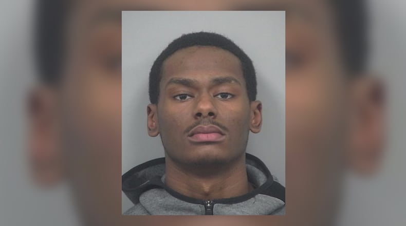 Tariq Strickland, 23, of Lilburn, is being sought by Gwinnett County police after he was charged with murder in the shooting death of 30-year-old Denzel Romanie.