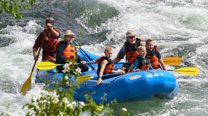 The Decker family, from left, Linda, Brandon, Andy, Colin and Alec, take a trip down the Spokane River with Wiley E. Waters Whitewater Rafting, Thursday, June 14, 2018. Linda and Andy gave their grandchildren the trip as a Christmas gift. (Dan Pelle/Spokesman-Review/TNS)