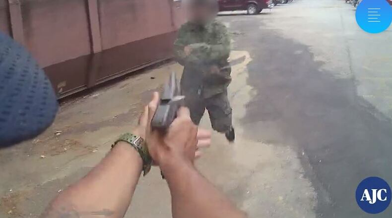 Body camera footage released in October shows the moment an officer fires at a machete-wielding suspect who lunged at him.