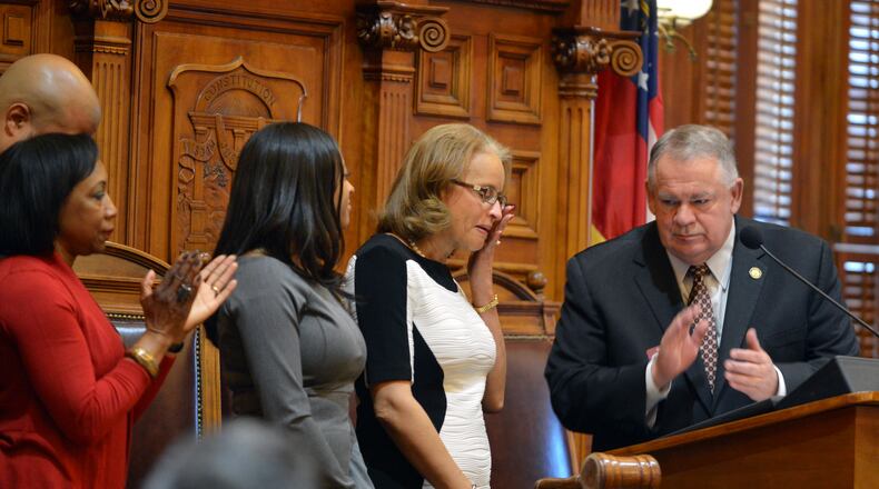 January 14, 2014 Atlanta: Linda Murphy wipes away a tear during a memorial in the House Chambers for her husband, the late Rep. Quincy Murphy. Lawmakers, including Speaker of the House David Ralston (R-Blue Ridge, right, paid tribute to Murphy and Rep. Calvin Hill, who both passed away since the last legislative session. BRANT SANDERLIN /BSANDERLIN@AJC.COM