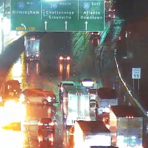 A spinout crash blocks lanes on I-285 North before the exit to I-20 West in Atlanta amid steady rain early Monday. Several crashes have caused trouble for the morning commute. (Channel 2 Action News)