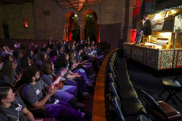 Organist Ken Double showcases organ Mighty Mo to students from Putnam County High School and Pebblebrook High School during Fox Theatre Shadowing Day at the Fox Theatre in Atlanta on Monday, March 23, 2026. (Arvin Temkar/AJC)