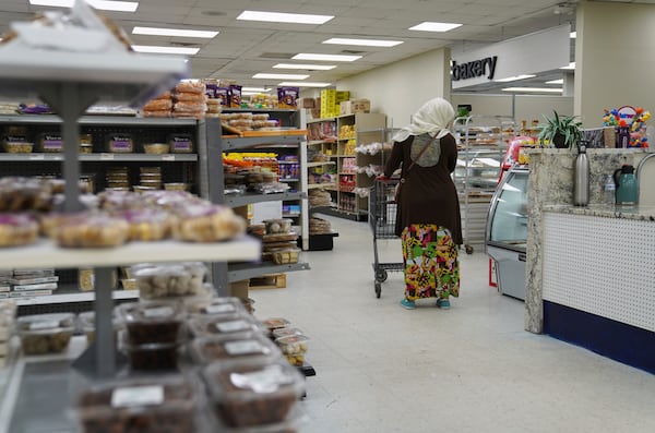Locals shop at the Finest Supermarket halal grocery store in Fredericksburg, Va., on Monday, April 7, 2025. (AP Photo/Jessie Wardarski)