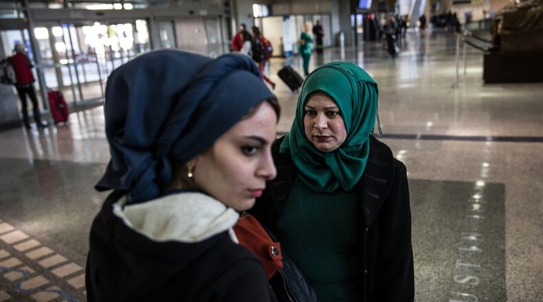 Noor Mohanad Majbal, 21, and her mother Nagham Abd Alstaar, refugees from Iraq, wait for their family to collect their luggage after arriving at Austin-Bergstrom International Airport on Feb. 15, 2017. The family was initially denied entry into the U.S. because of President Trump’s first travel ban. (Tamir Kalifa/ AMERICAN-STATESMAN)