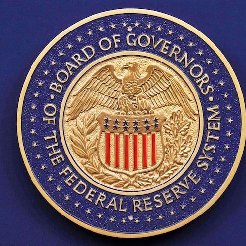 FILE - A seal is seen before Federal Reserve Chairman Jerome Powell walks out to speak during a news conference following the Federal Open Market Committee meeting, Wednesday, Sept. 17, 2025, at the Federal Reserve Board Building in Washington. (AP Photo/Jacquelyn Martin, file)