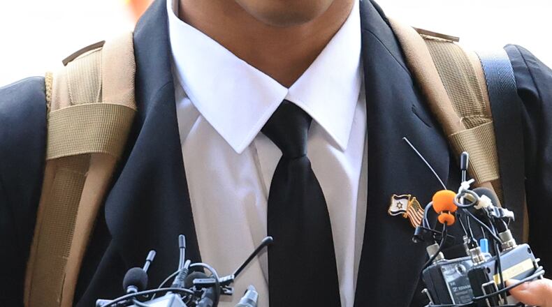 American YouTuber Johnny Somali speaks to reporters as he arrives at the Seoul Western District Court in Seoul, South Korea, Wednesday, April 15, 2026. (Choi Jae-koo/Yonhap via AP)