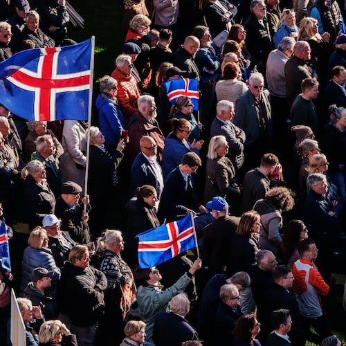 People with Icelandic flags attend an "Afram Island", "Forward, Iceland", rally, opposing the resumption of European Union accession talks at Austurvollur in Reykjavik, Iceland, Thursday, Aug. 27, 2026. (AP Photo/Marco Di Marco