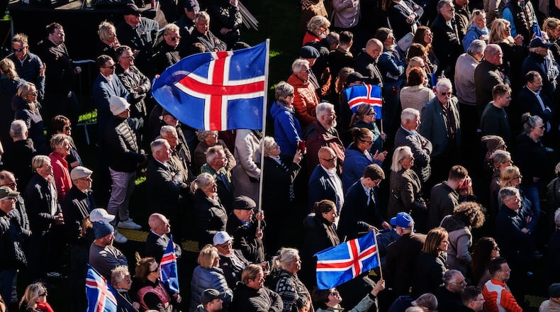 People with Icelandic flags attend an "Afram Island", "Forward, Iceland", rally, opposing the resumption of European Union accession talks at Austurvollur in Reykjavik, Iceland, Thursday, Aug. 27, 2026. (AP Photo/Marco Di Marco
