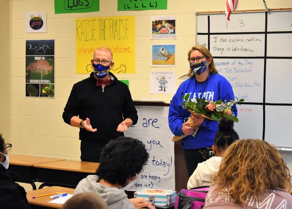 Cherokee County Superintendent of School Dr. Brian V. Hightower asks CCSD Teacher of the Year Cathy Fernandez's class at E.T. Booth Middle School what makes her a great teacher.