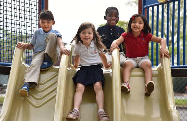 Kindergartners (from left) Ian DeOliviera, Adam Ajayi, Ximena Benitez and Eden Sterling, all 6, at Carman Adventist School in Marietta. HYOSUB SHIN / HSHIN@AJC.COM