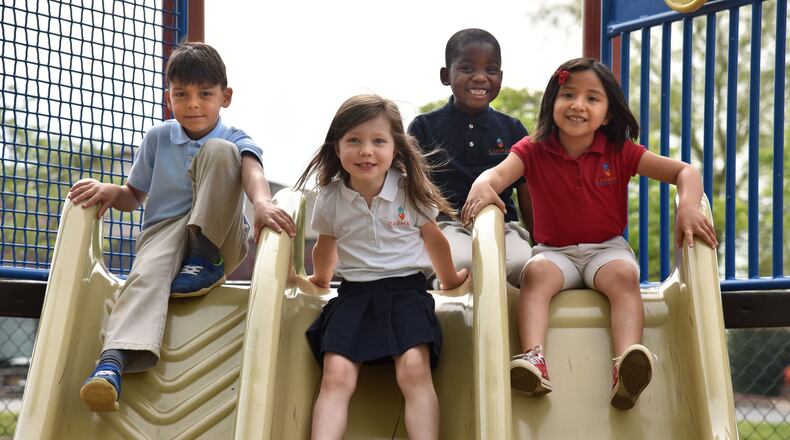 Kindergartners (from left) Ian DeOliviera, Adam Ajayi, Ximena Benitez and Eden Sterling, all 6, at Carman Adventist School in Marietta. HYOSUB SHIN / HSHIN@AJC.COM
