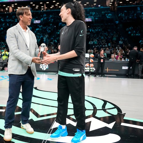 The Associated Press' Global Sports Editor Josh Hoffner presents the Greatest Player award to New York Liberty forward Breanna Stewart ahead of a WNBA basketball game against the Dallas Wings, Tuesday, July 7, 2026, in New York. (AP Photo/Yuki Iwamura)