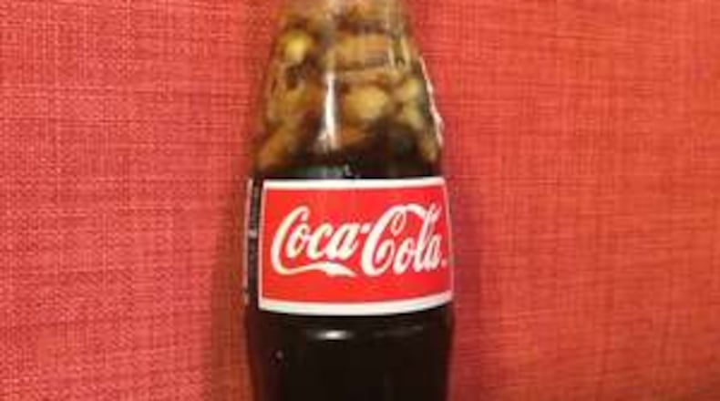Dumping a packet of salted peanuts into a bottle of Coca-Cola is a decidedly Southern tradition. / Photo by Ligaya Figueras