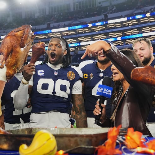 Dallas Cowboys wide receiver CeeDee Lamb (88) and tight end Jake Ferguson (87) celebrate following an NFL football game against the Kansas City Chiefs Thursday, Nov. 27, 2025, in Arlington, Texas. (AP Photo/LM Otero)