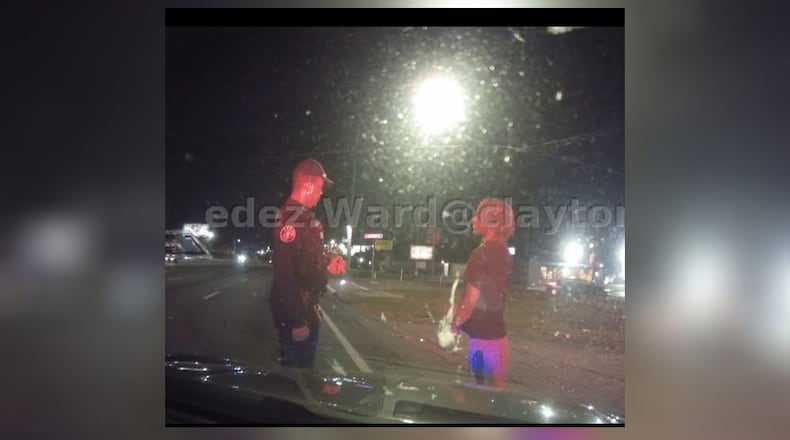 A Clayton County officer speaks to TraZion Brown about jaywalking in a situation that ultimately led to Brown's arrest on a bench warrant in a murder case.