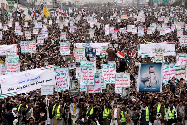 Thousands of Houthi supporters chant slogans during an anti-U.S. and anti-Israel rally in Sanaa, Yemen, Friday, April 18, 2025. (AP Photo/Osamah Abdulrahman)