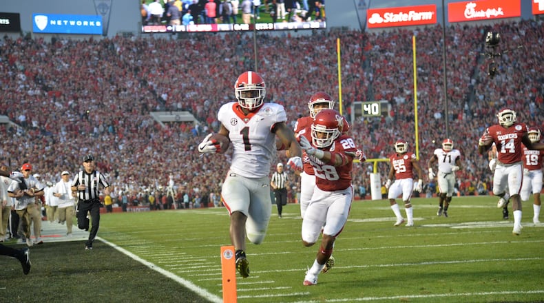 Georgia running back Sony Michel (1) scores a touchdown in the second half of the College Football Playoff semifinal between Georgia and Oklahoma at Rose Bowl Stadium in Pasadena, California on Monday, January 1, 2018. Georgia won 54-48. Hyosub Shin / hshin@ajc.com