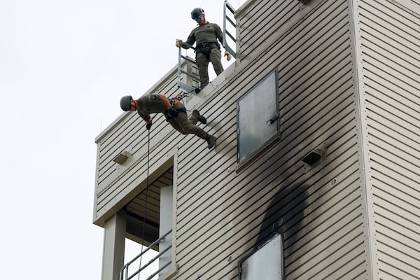 Atlanta Police Department officers practice rappelling down the fire tower at the Atlanta Public Safety Training Center on Monday, May 11, 2026, in Atlanta, Ga. (Jason Getz/AJC)