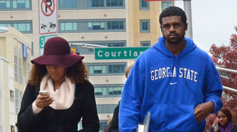 Georgia State University students Chanel Smith (left) and Donald Johnson walk to class. According to the Georgia Department of Labor, workers with four-year degrees earn $68,958, on average.