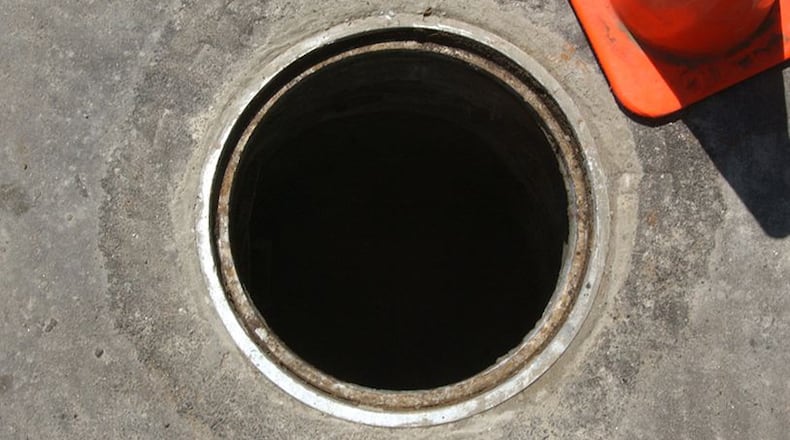 An overflow was discovered coming through a manhole in McDonough.