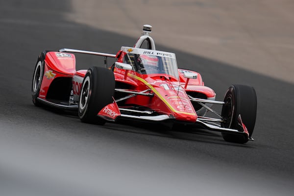 Will Power, of Australia, drives through the first turn during practice for the Indianapolis 500 auto race at Indianapolis Motor Speedway in Indianapolis, Thursday, May 15, 2025. (AP Photo/Michael Conroy)