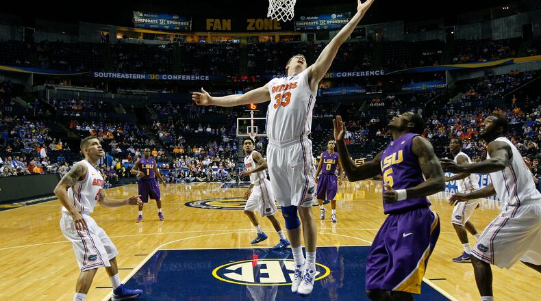 Florida forward/center Erik Murphy (33) works against the LSU during the first half of an NCAA college basketball game at the Southeastern Conference tournament, Friday, March 15, 2013, in Nashville, Tenn. (AP Photo/Dave Martin)