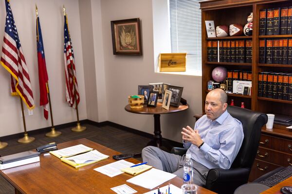 Georgia Attorney General Chris Carr holds a meeting in his office.