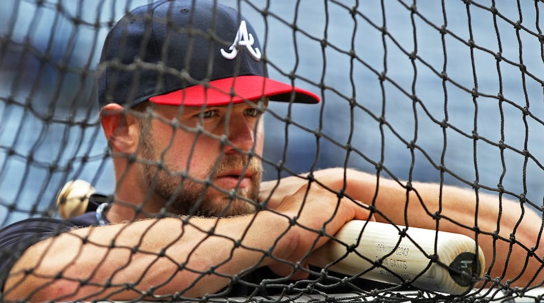 Braves rookie catcher Evan Gattis takes in the scene during batting practice Sunday, March 31, 2013, at Turner Field in Atlanta.