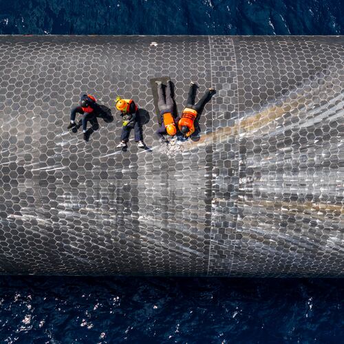 This image provided by SpaceX on Aug. 27, 2026, shows engineers inspecting Starship off the coast of Christmas Island in the Indian Ocean, following its launch on a test flight back in July. (SpaceX via AP)