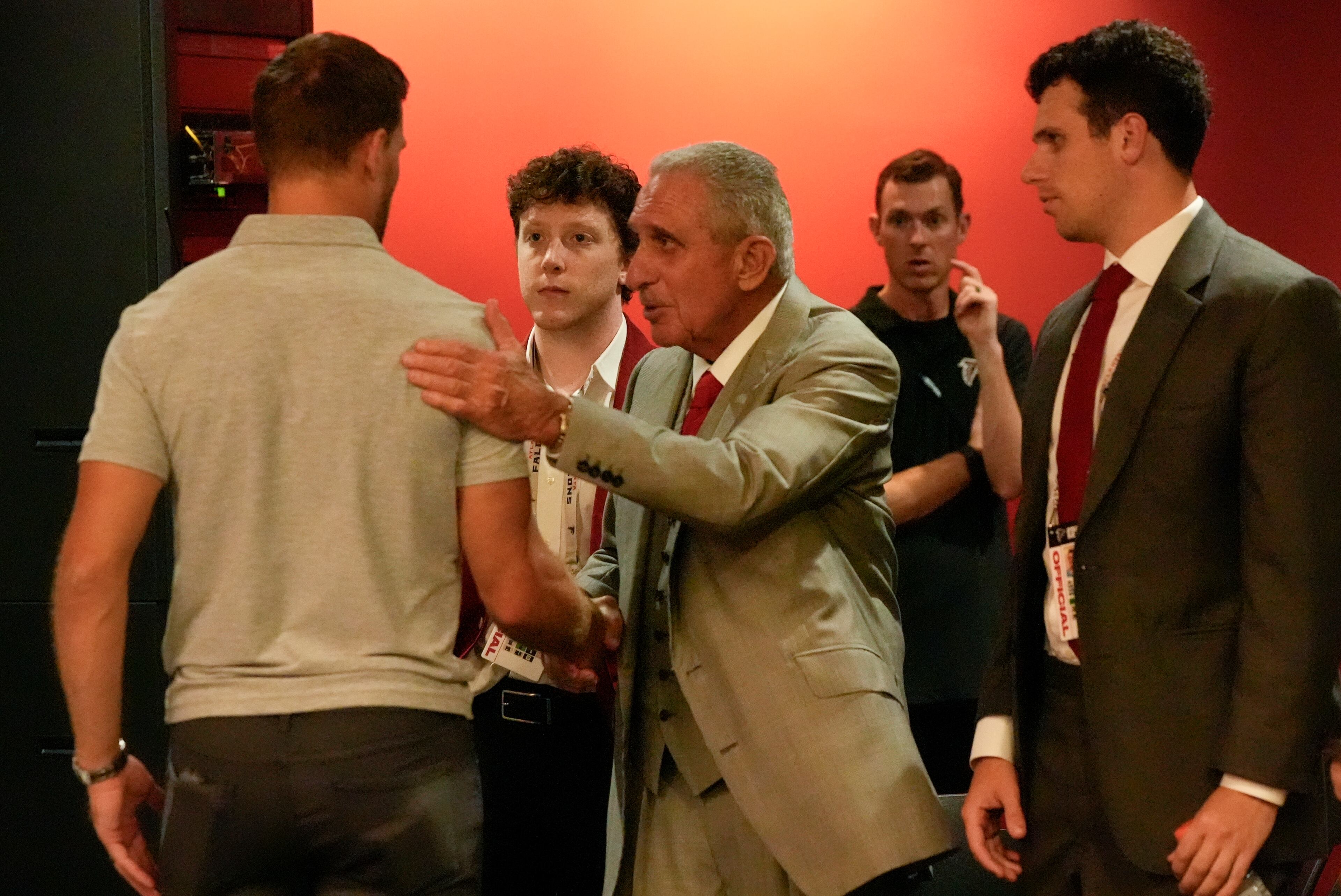 Atlanta Falcons owner Arthur Blank greets quarterback Kirk Cousins The team and the player have a few options left heading into mandatory minicamp. (John Bazemore/AP)