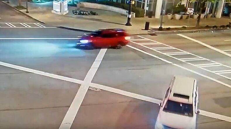 Atlanta police need the public's help to identify the driver of a red SUV believed to be involved in a drive-by shooting.