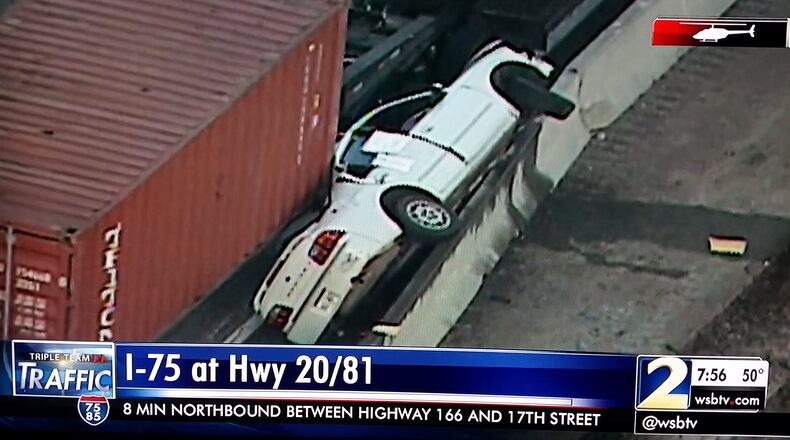 Two injuries were reported when this car and truck collided on I-75 in Henry County Friday morning. WSB-TV photo.
